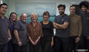 Staff take group picture with patient