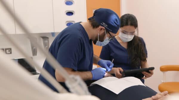 doctor and nurse treating a dental implant patient