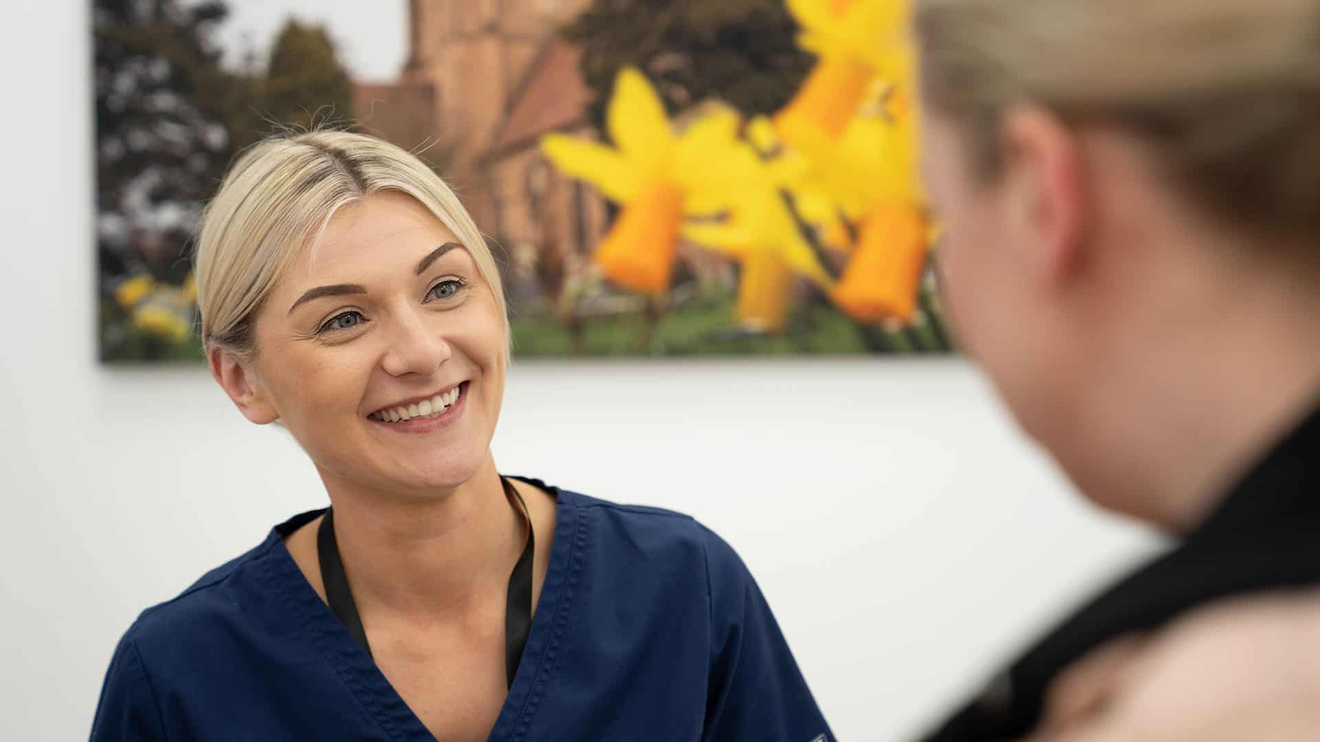 patient and nurse talk about upcoming smile in a day treatment