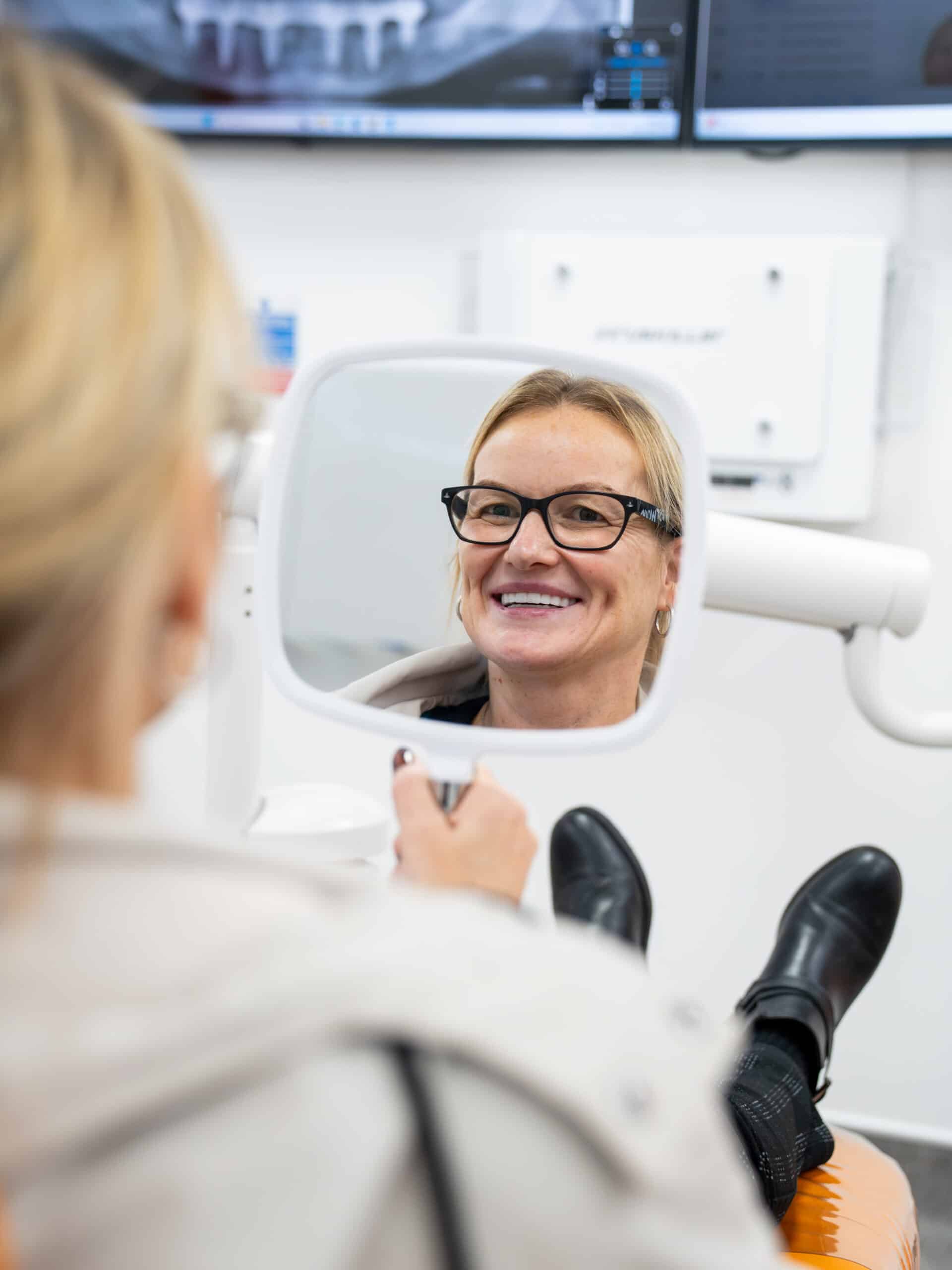 EvoDental patient looking at new dental implants
